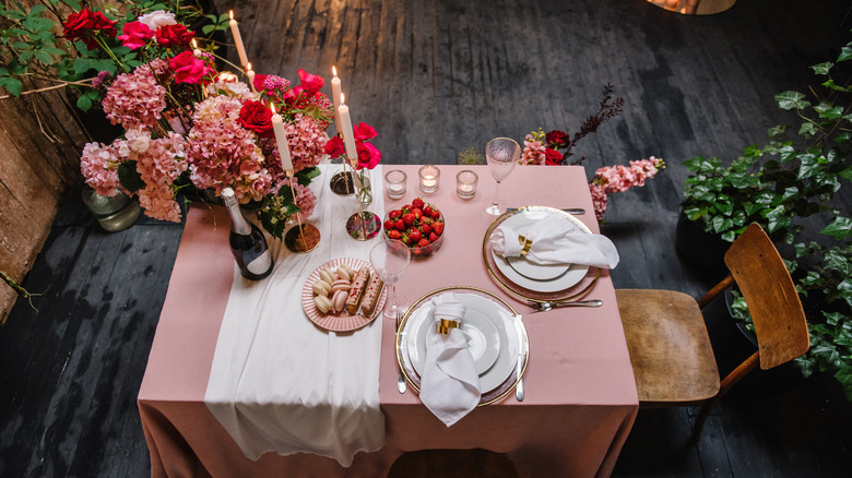 A beautiful table is set for a romantic candlelit dinner