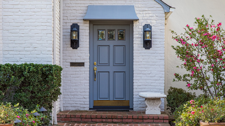 blue front door on white house