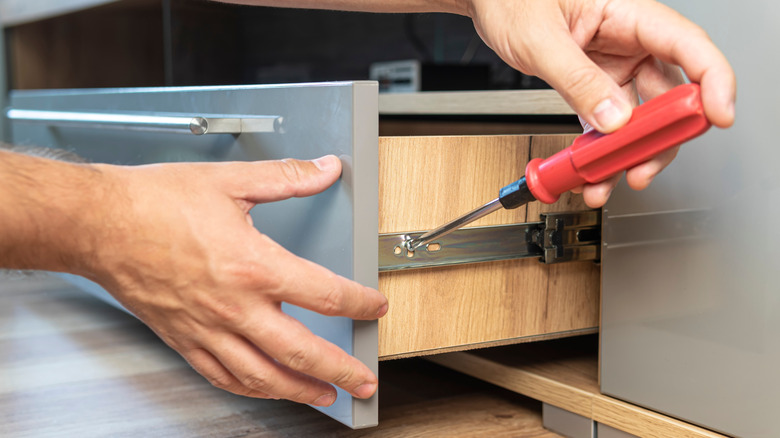 Attaching a drawer slide to a drawer box