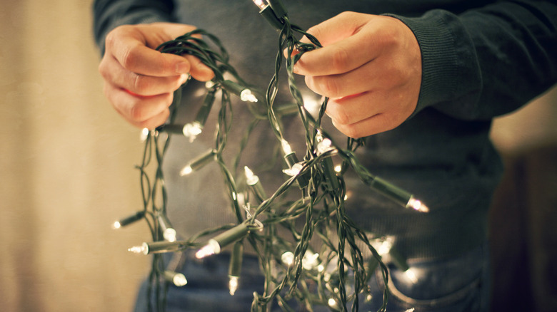 person with string lights