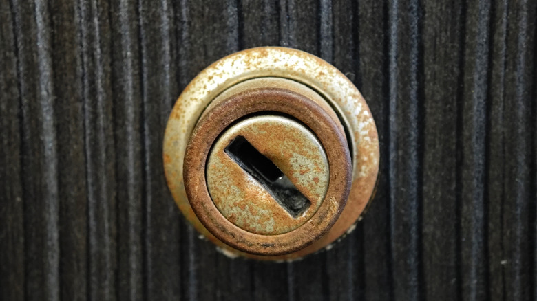 A keyhole with rust stains