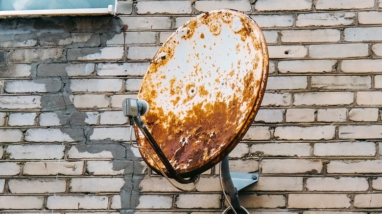 old satellite dish on wall