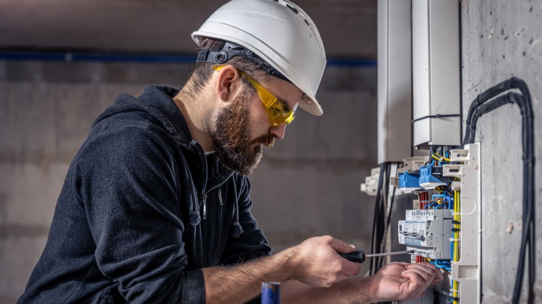 electrician working on panel