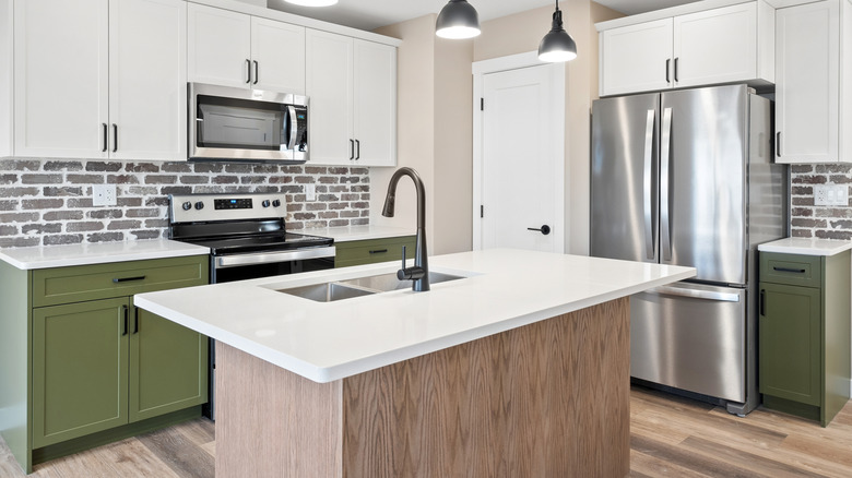 Kitchen with a gray brick backsplash.