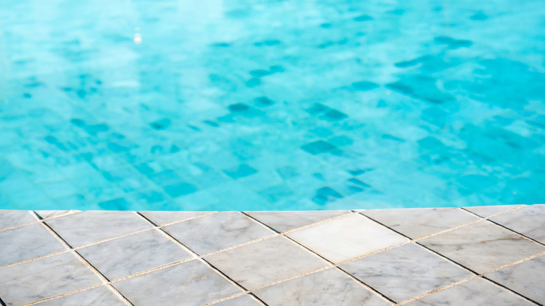 The edge of the pool uses tile.