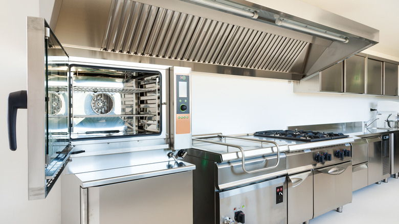 Industrial kitchen with open microwave