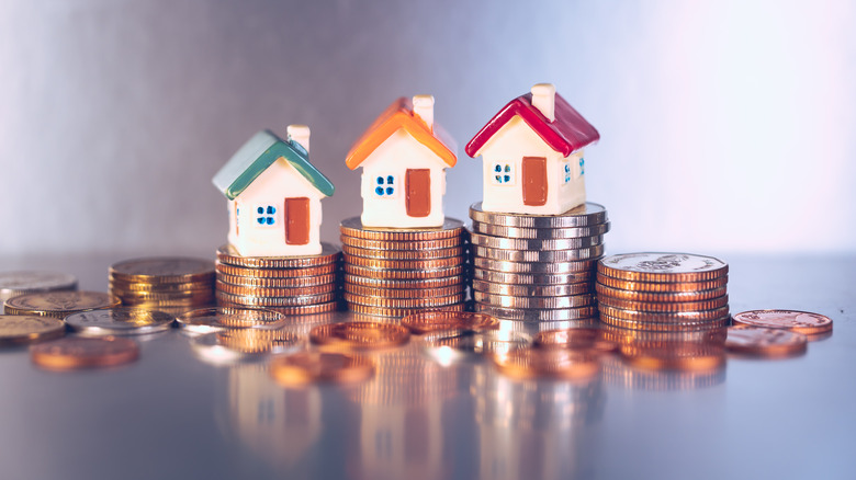 little houses on stacked coins