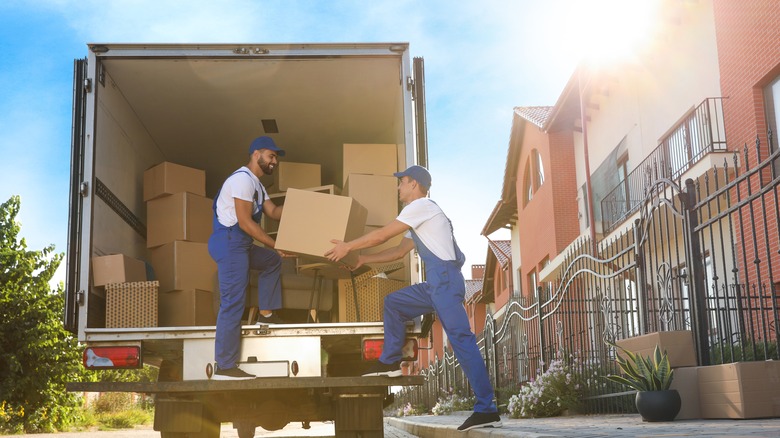 putting boxes into moving van