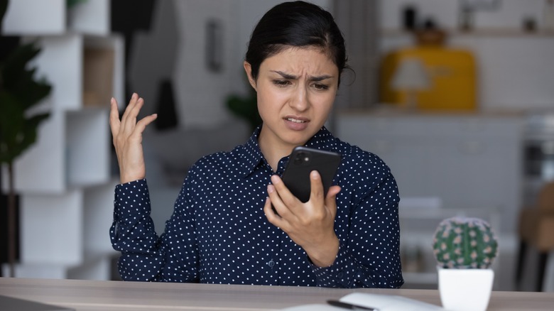 woman annoyed on phone