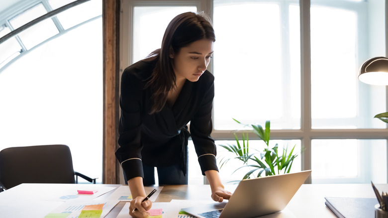 woman studying at desk