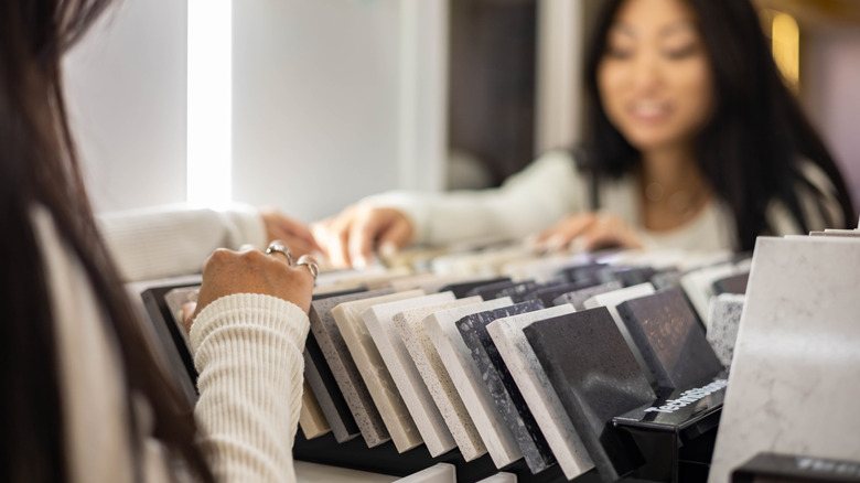 Woman looking through countertop samples