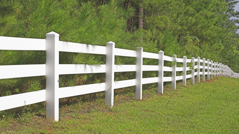 white vinyl split rail fence