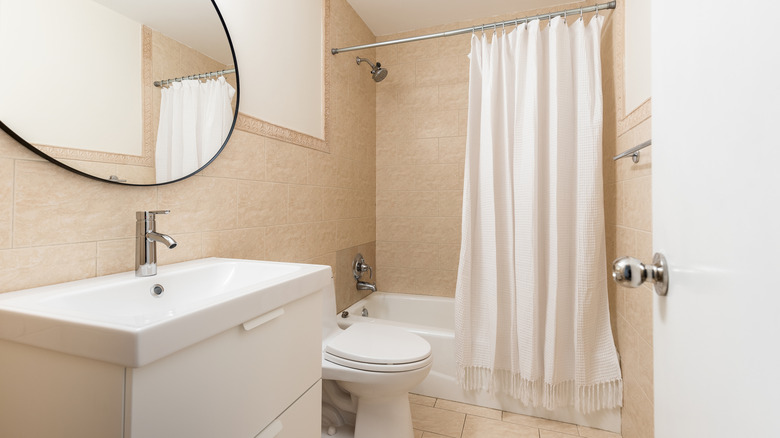 White shower curtain in bathroom