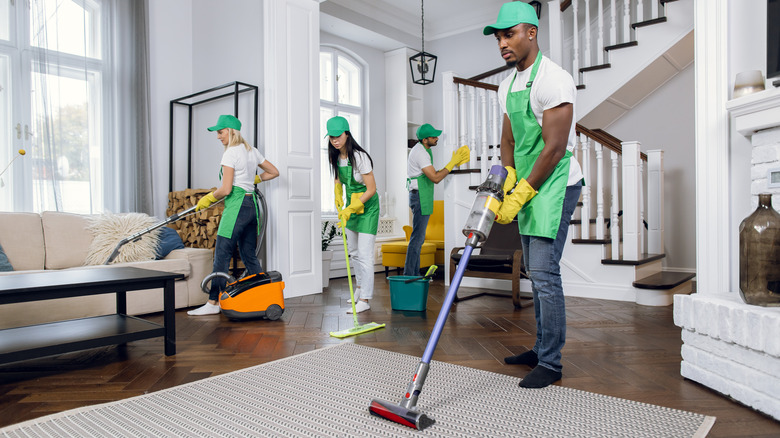 Professional team cleaning client's house