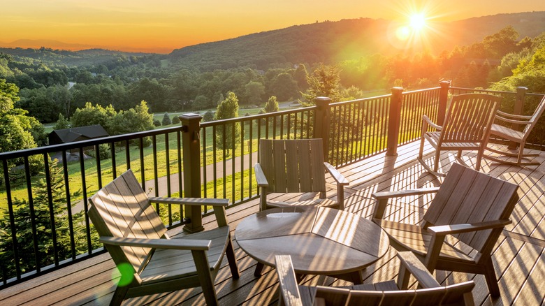 Furniture sitting on deck, sunrise