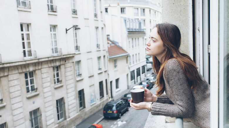 Woman leaning out of window