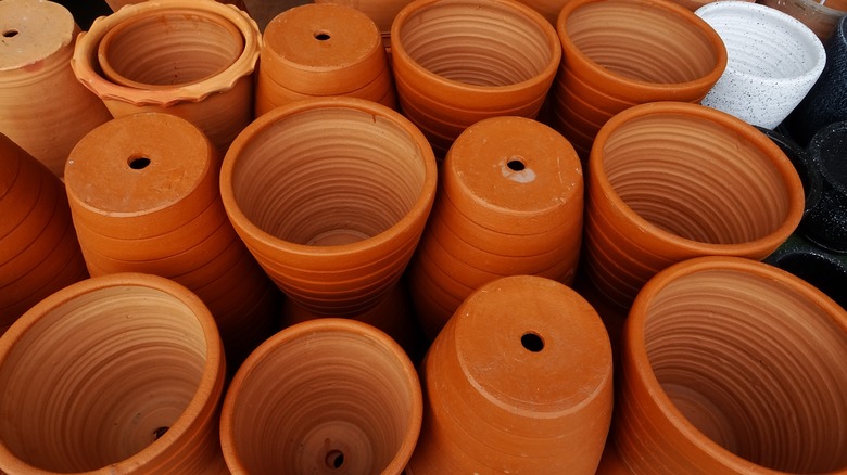 Multiple clay pots drainage holes