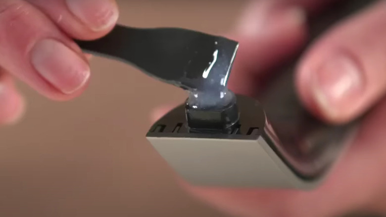 applying glue to microwave handle