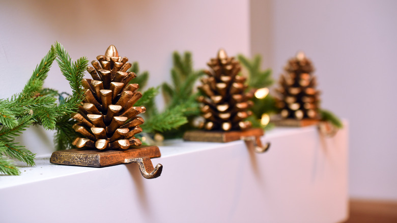 pinecone stocking holders on mantel