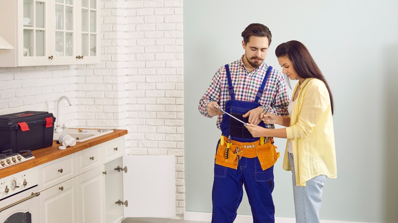 a contractor inspecting the kitchen