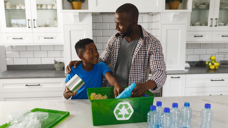 Happy family recycling 