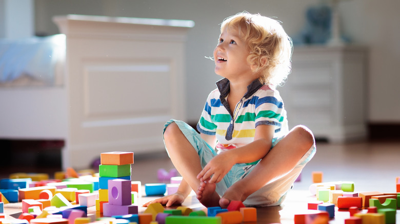 child playing on floor 