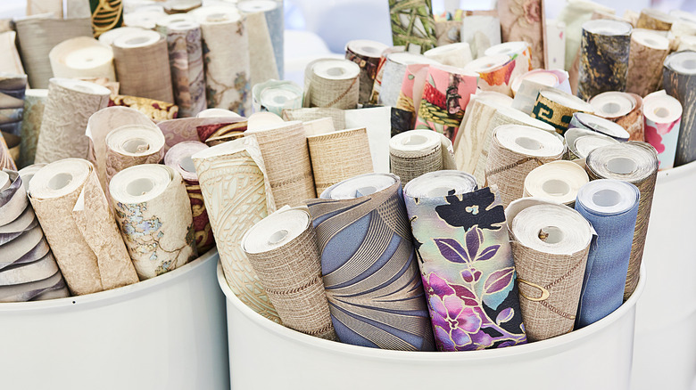 Buckets of wallpaper rolls