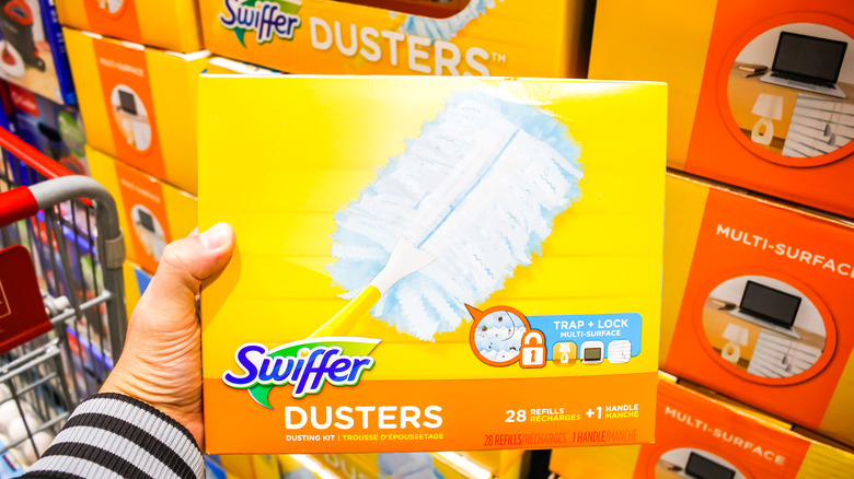 Hand holding Swiffer box