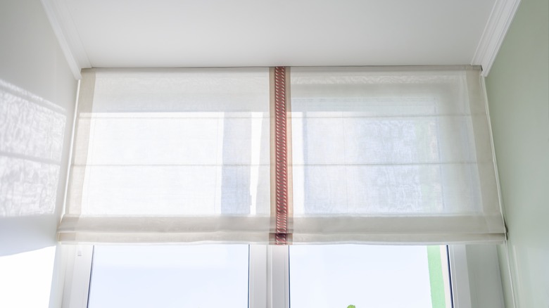 Fabric blinds on bright window