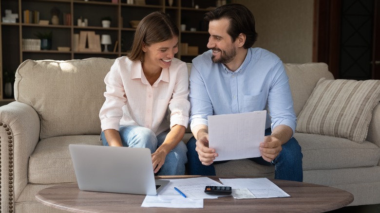 couple reading mortgage information