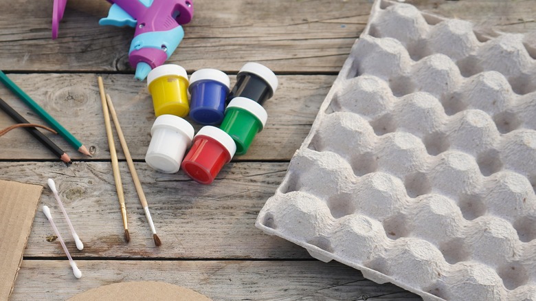 Egg carton with paint crafting supplies