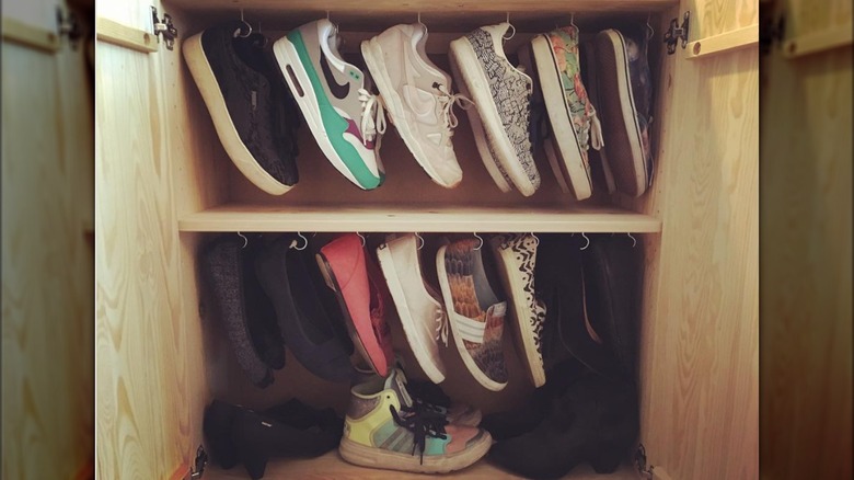 Shoes hanging in cabinet