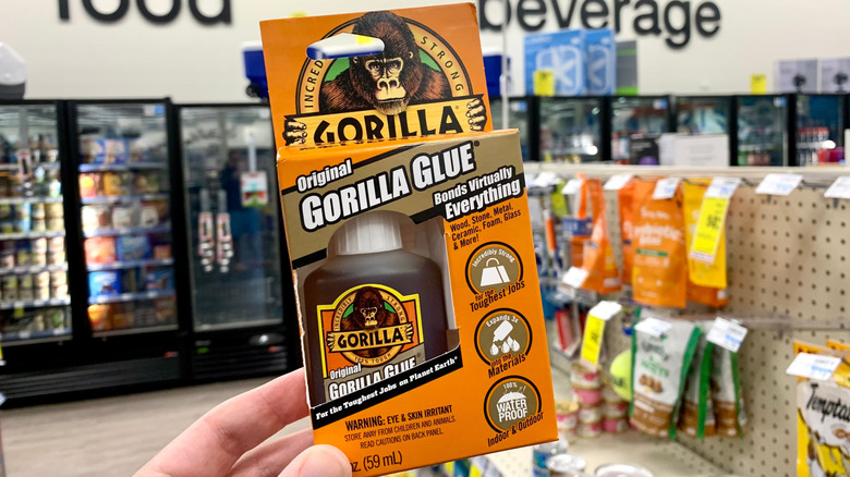 Person holding Gorilla Glue package