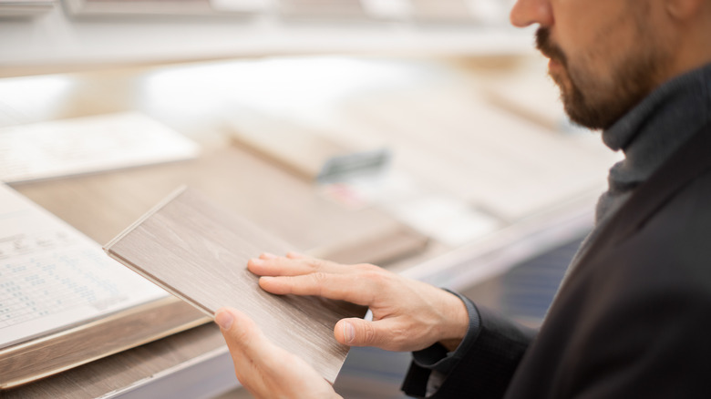 man shopping for teak backsplash