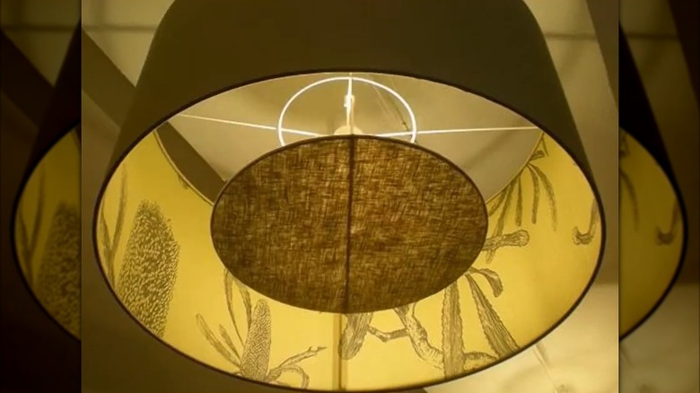 A decorative inset diffuser in an overhead light