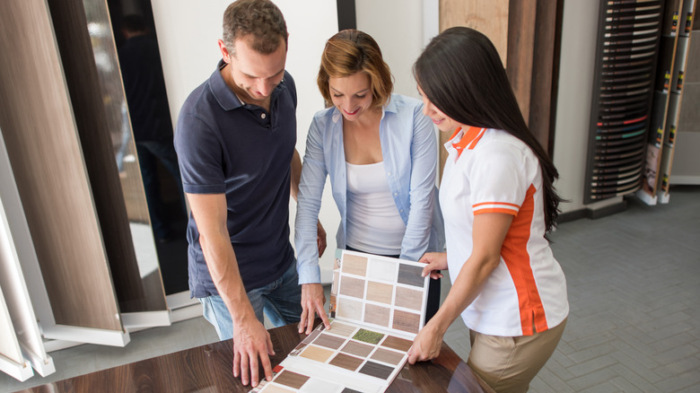 Couple shopping for flooring materials