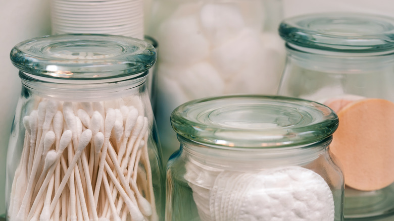 bathroom items in glass jars