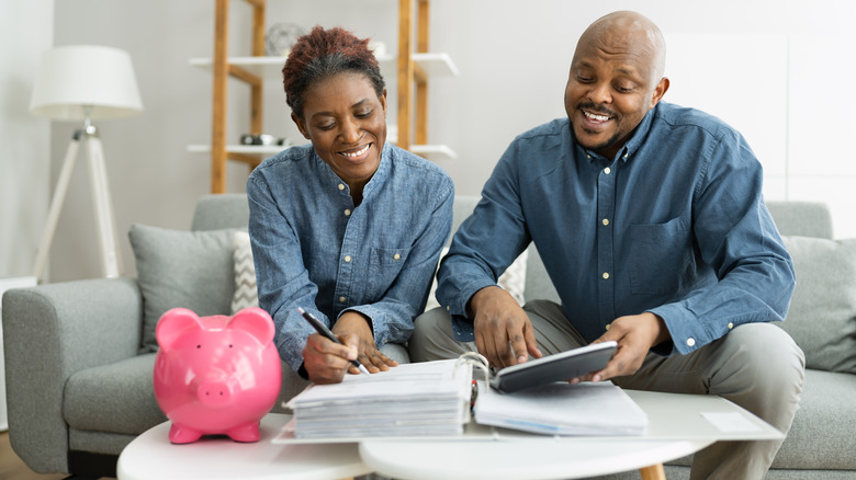 couple saving in piggy bank