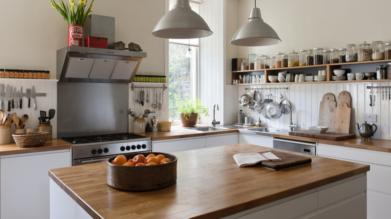 A kitchen with wooden butcher block countertops.