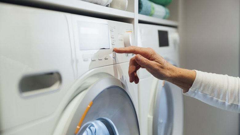 Person pressing dryer button