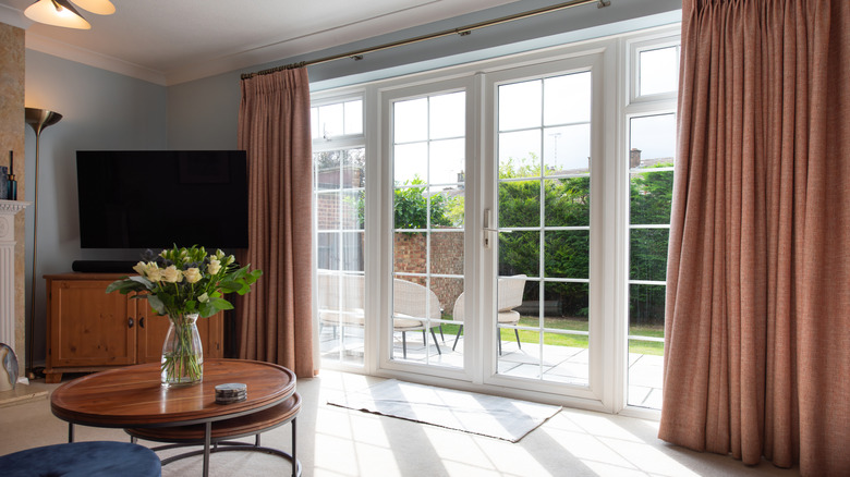 Floor to ceiling door windows in living room