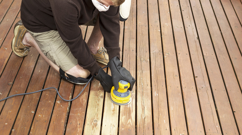 Sanding wood deck