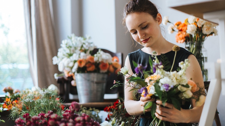 woman arranging flowers