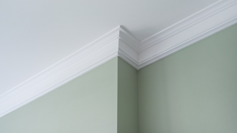 Crown molding on green walls