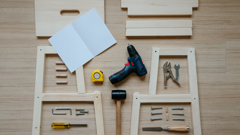 man assembles Ikea furniture