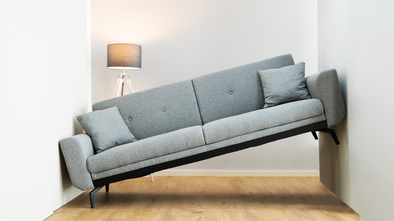 gray couch that doesn't fit