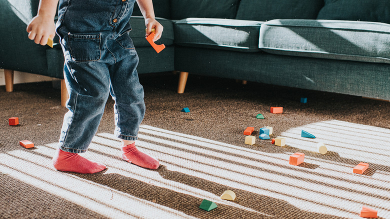 Child playing on carpet