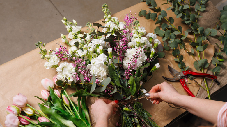 Florist making an arrangement of fresh flowers