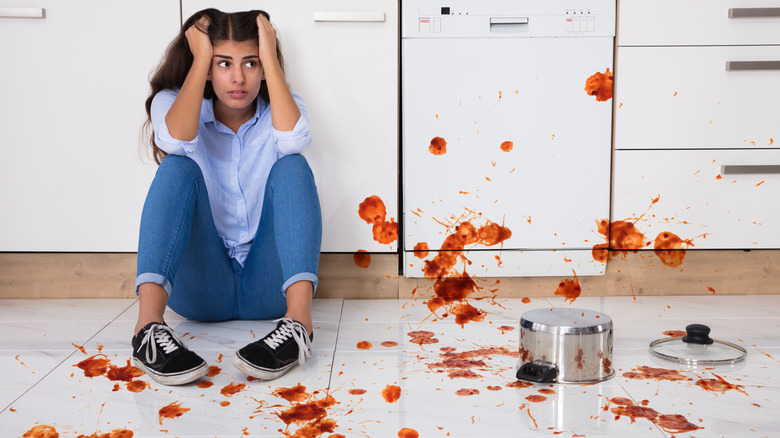 Woman frustrated over kitchen spills