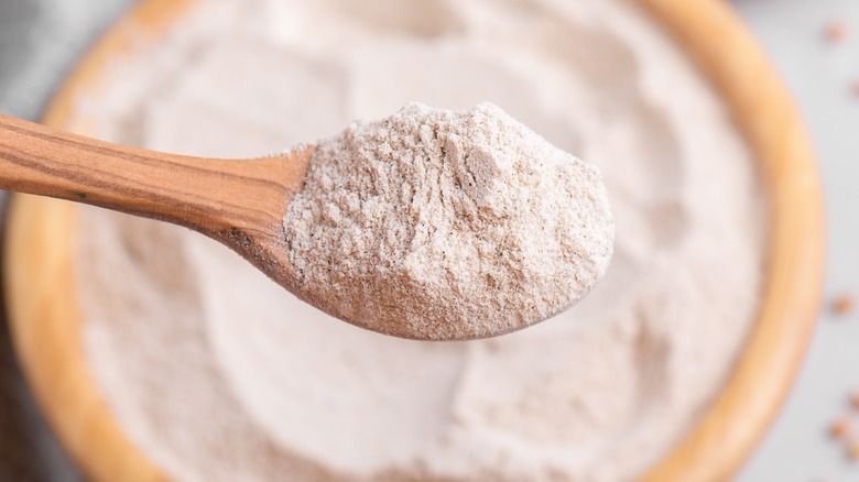 wooden spoon with flour